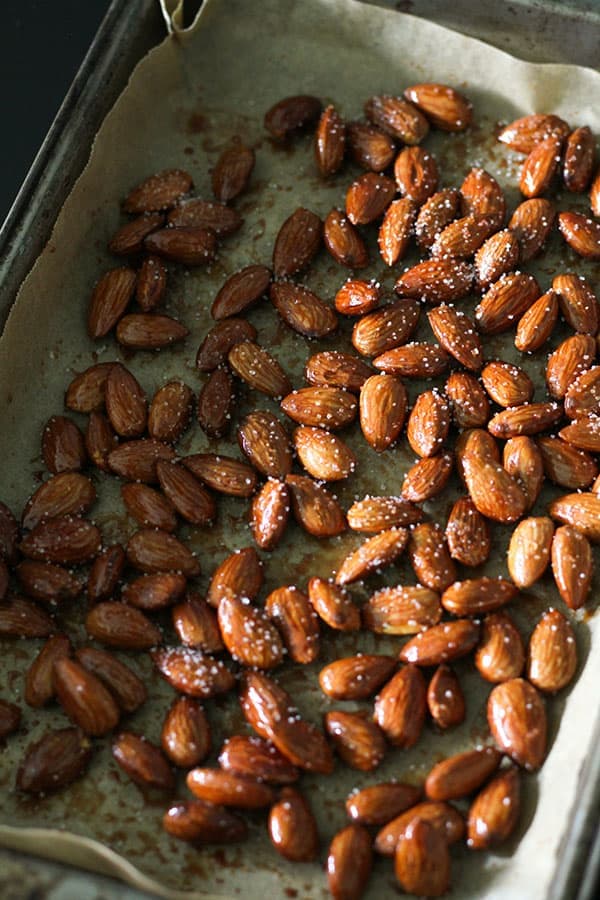 roasted almonds on a baking tray.