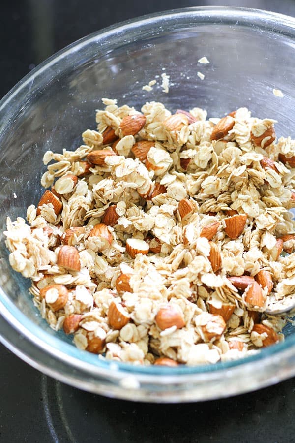 granola ingredients in a glass bowl.