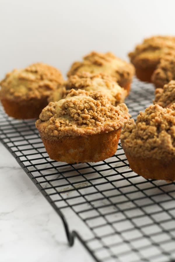 cinnamon muffins on a cooling rack.