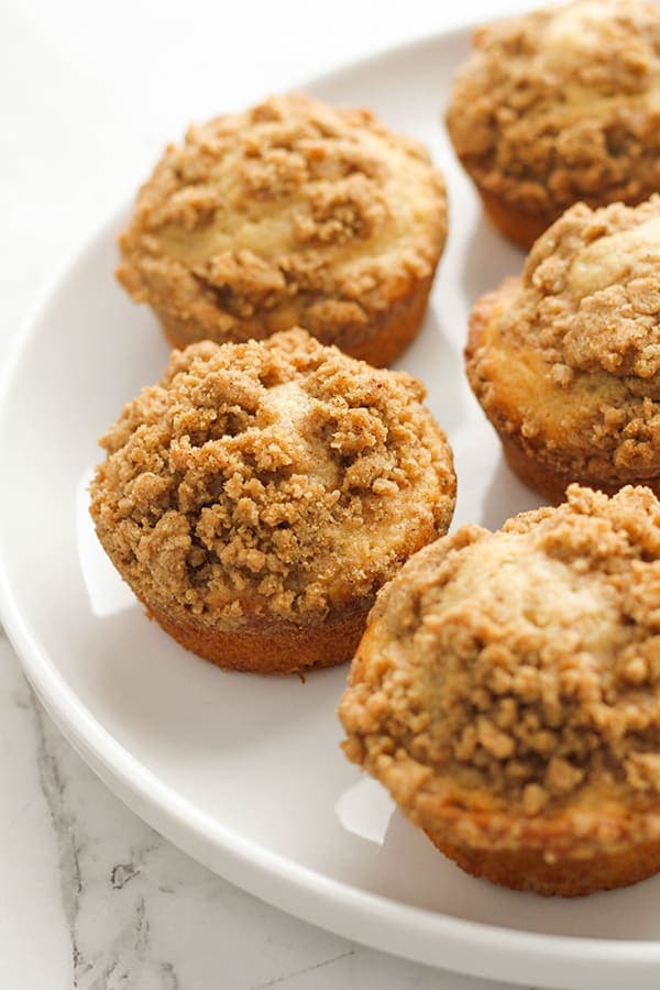 cinnamon muffins on a white plate. 