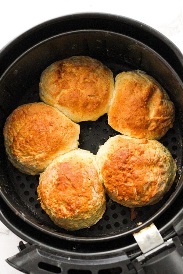 freshly baked scones in the air fryer basket.