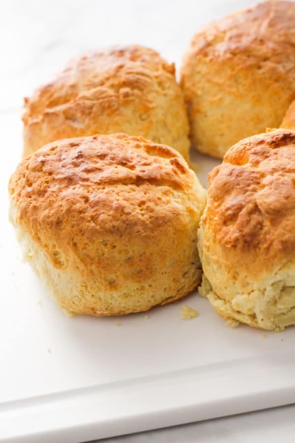 scones on a white cutting board.