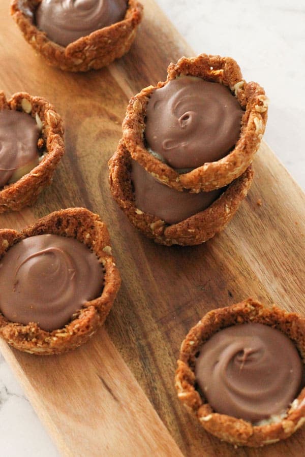 caramel tarts on a wooden board.