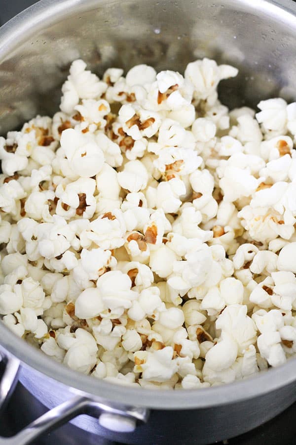 freshly popped popcorn in a saucepan.