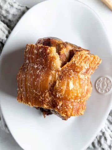 air fryer roast pork on a white platter.