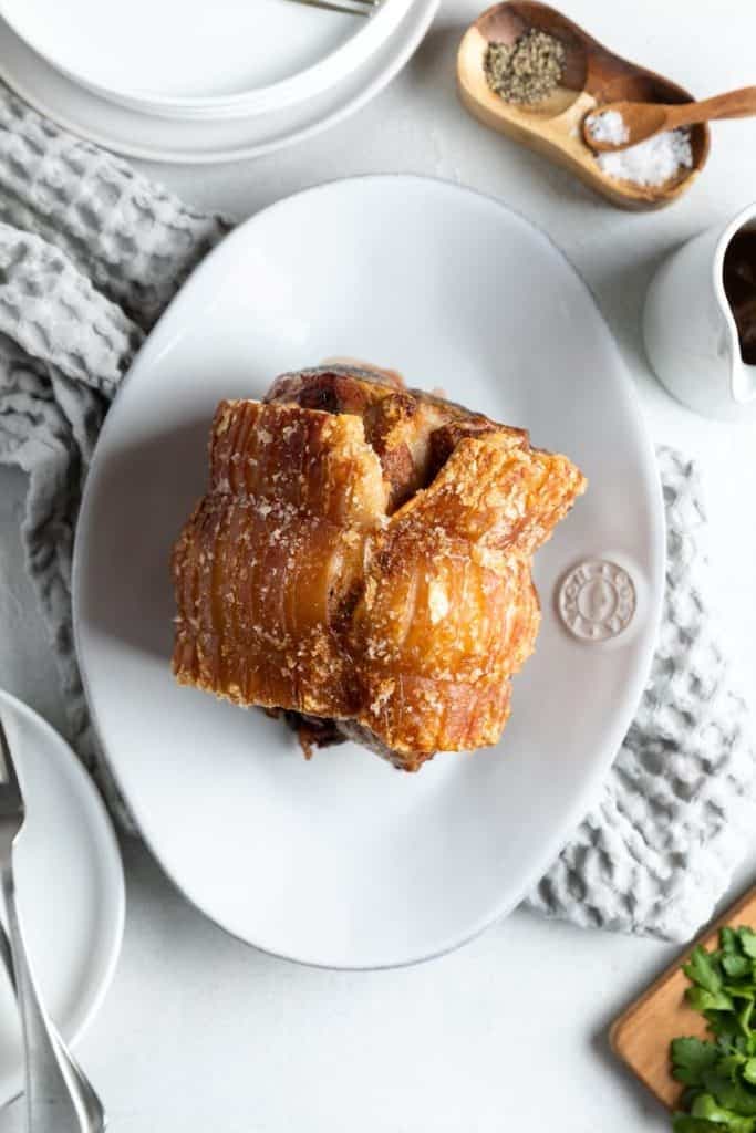 air fryer roast pork on a white platter.