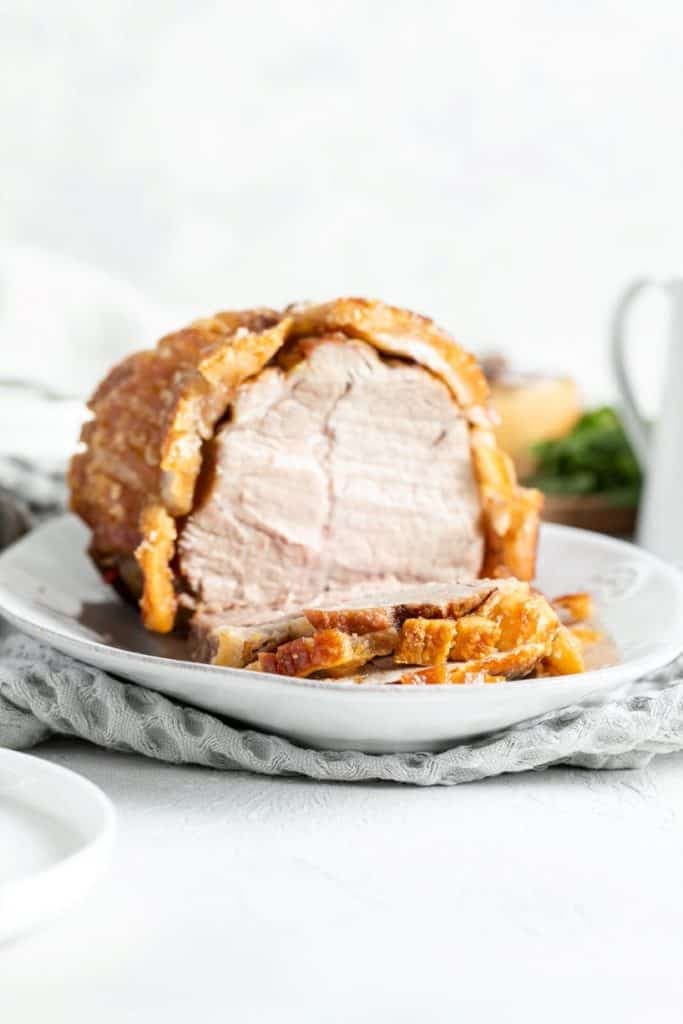 pork roast sliced on a serving platter.