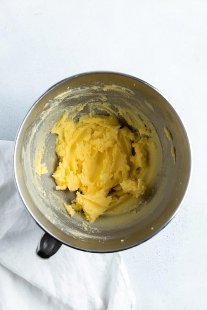 butter and sugar creamed together in a mixing bowl.