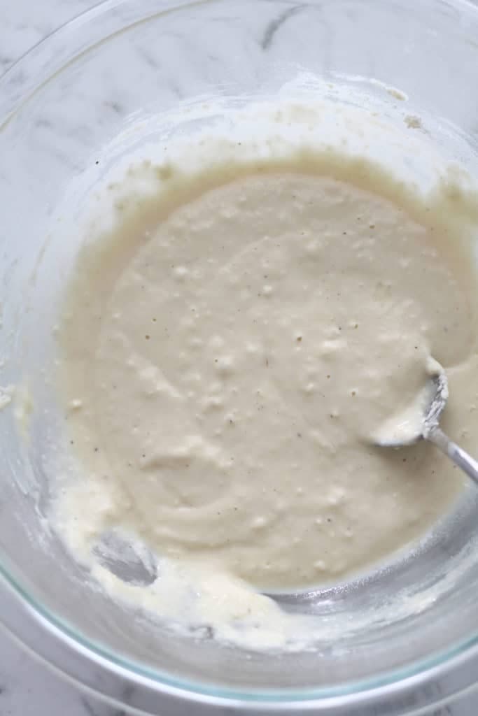 fritter batter in a glass bowl.