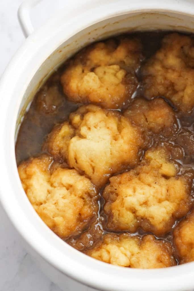 caramel dumplings in a white baking dish.