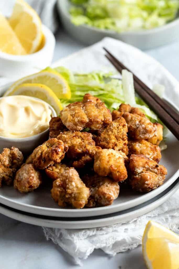 crispy karaage chicken on a grey plate.