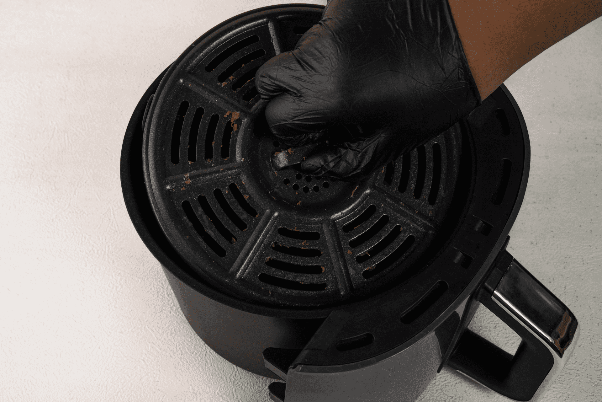 <strong>Clean and dry removable parts</strong>: Once the air fryer is cool, remove the tray and basket and place them in the dishwasher. Alternatively, hand-wash with warm, soapy water or the <a href="https://amzn.to/3OQ7S6o">dawn powerwash dish spray. </a>If you just air-fried and there's baked-on grease in the basket, fill it with hot water and add a few drops of dish soap. Allow it to soak for 15-20 minutes, and then use a <a href="https://amzn.to/3URCOak">small brush</a> to scrub the remnants away. Once the removable parts are all washed up, dry them with a <a href="https://amzn.to/48Bgbdg">microfiber cloth</a>. Never put them damp back to the air fryer.<br/>