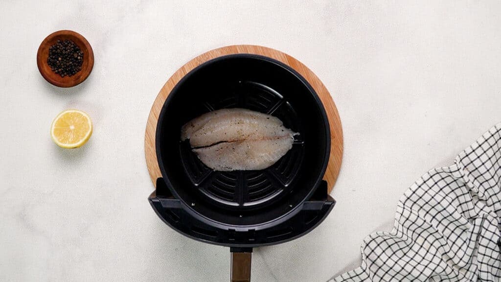 Tilapia fillet in air fryer basket