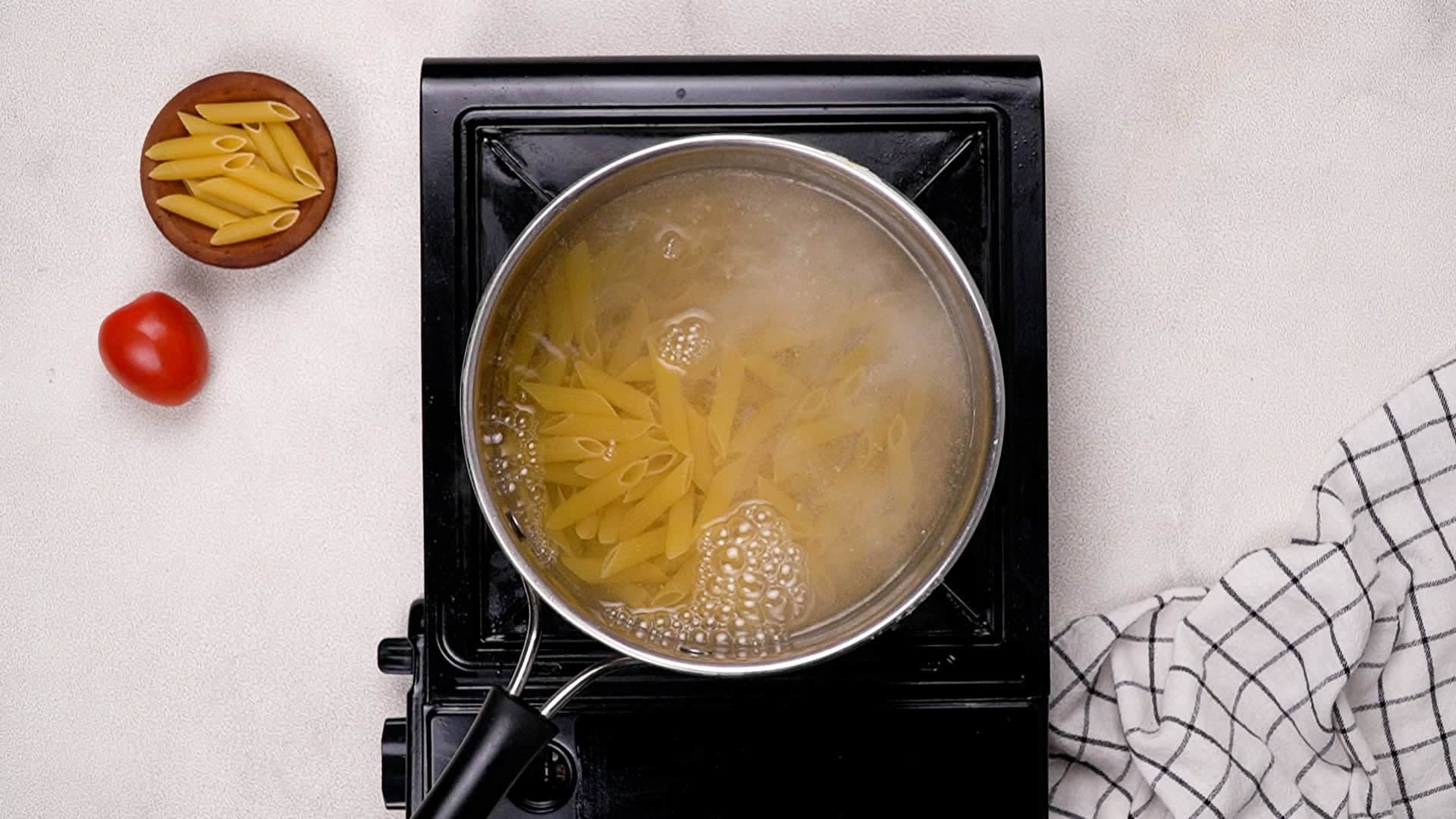 Boil your pasta in a large pot of salted water until it reaches an al dente texture, following the package instructions. (Before draining, reserve ½ cup of the starchy pasta water and set it aside for use in the sauce.<br/>
