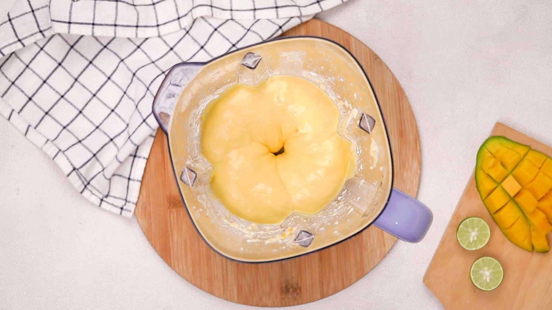 Blend the ingredients on high speed for at least one minute until the mixture is completely smooth. It's important to break down the mango fibres to achieve the silky texture the pudding is known for.