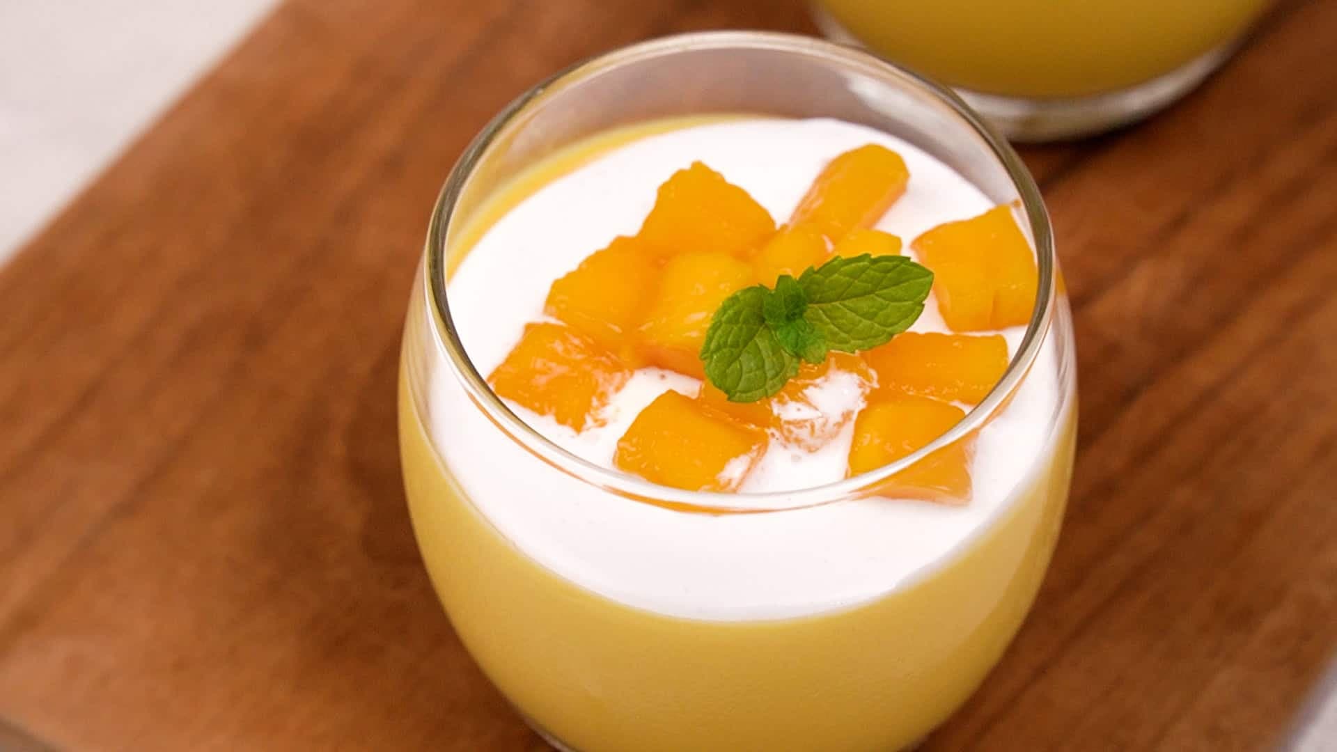 When ready to serve, add some whipped cream on top of the pudding and garnish with fresh mango cubes for a tropical finish. Enjoy!