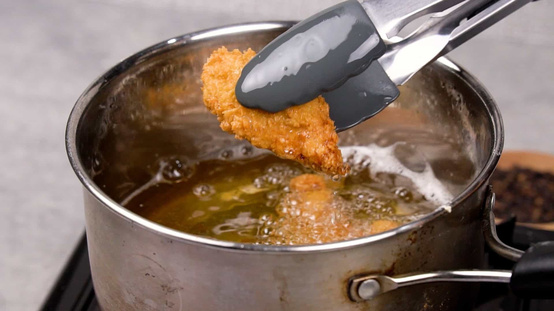 Cook the chicken until it's golden brown and crispy.