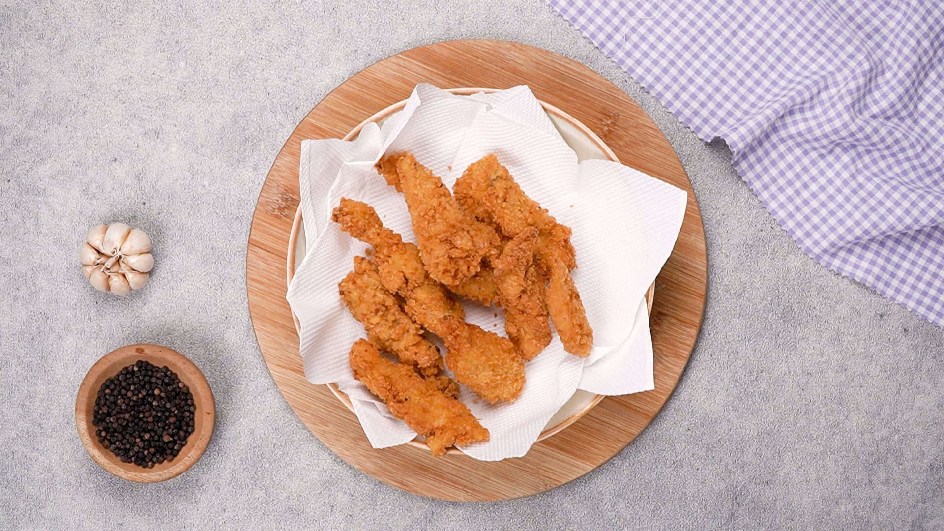Once fried, remove the chicken tempura pieces from the hot oil and place them on a wire rack or paper towels to absorb any excess oil.