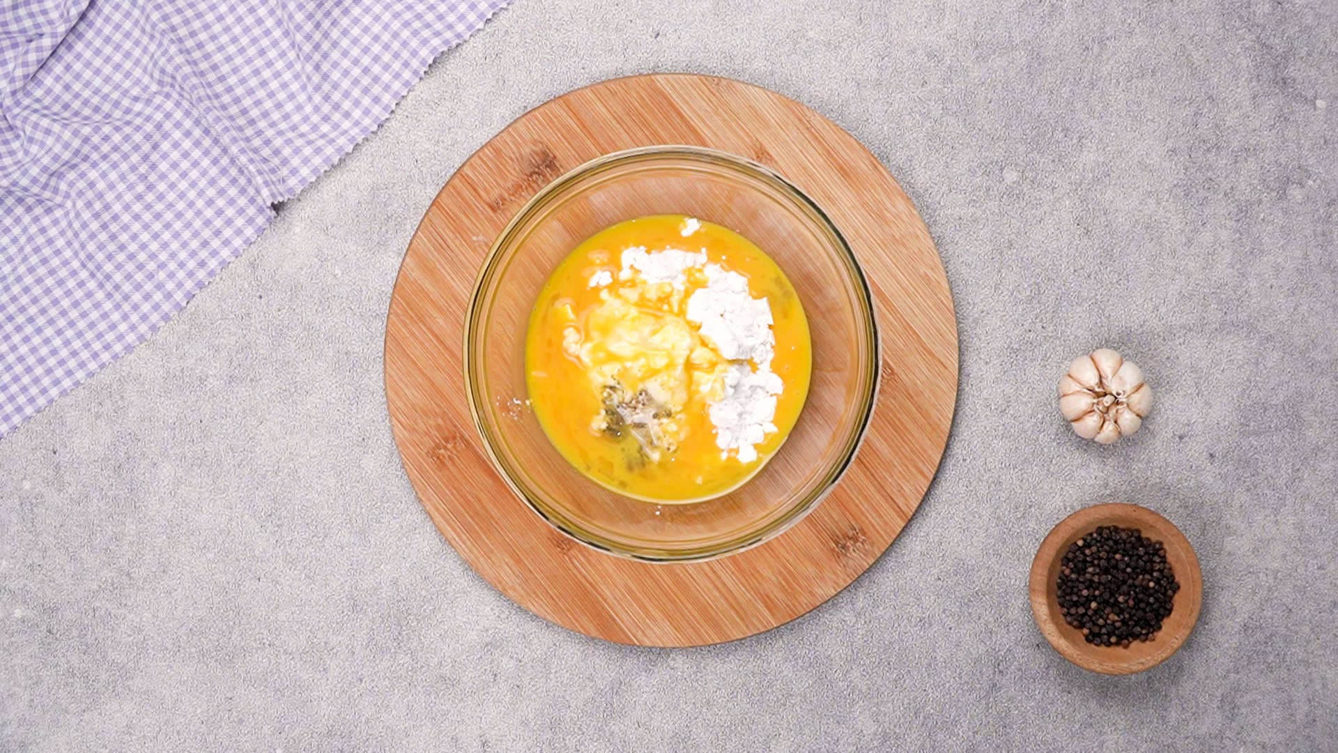 In another bowl, add the whisked egg, flour, cornstarch, and a pinch of ground black pepper.