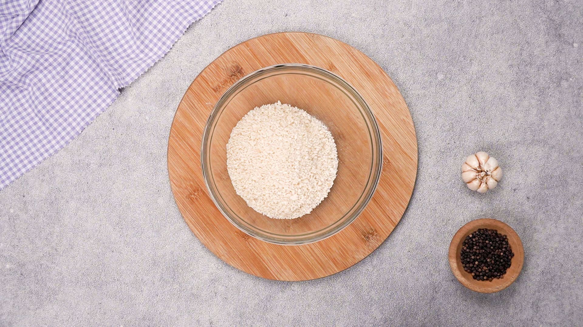 Place the panko breadcrumbs in a separate bowl.