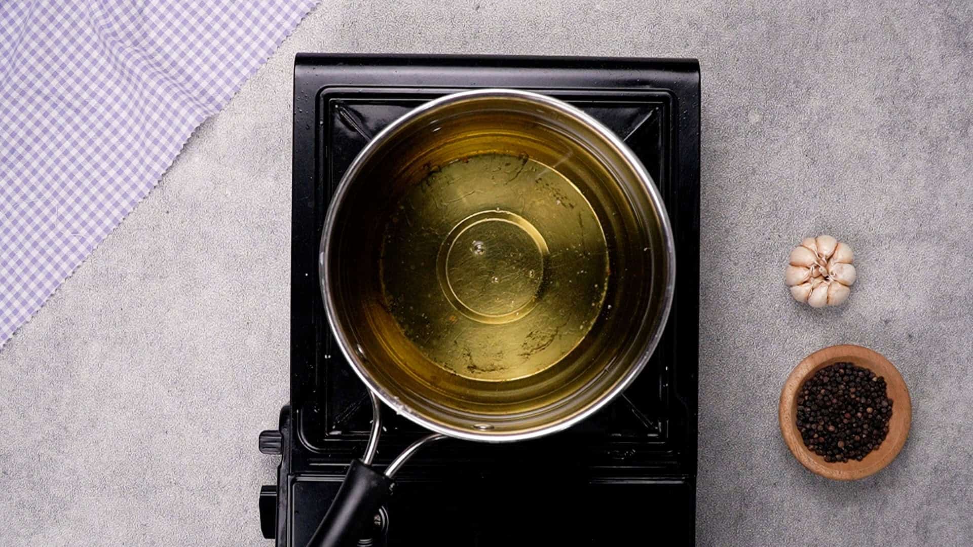 Heat vegetable oil in a deep frying pan or medium saucepan over medium heat until it begins to shimmer.