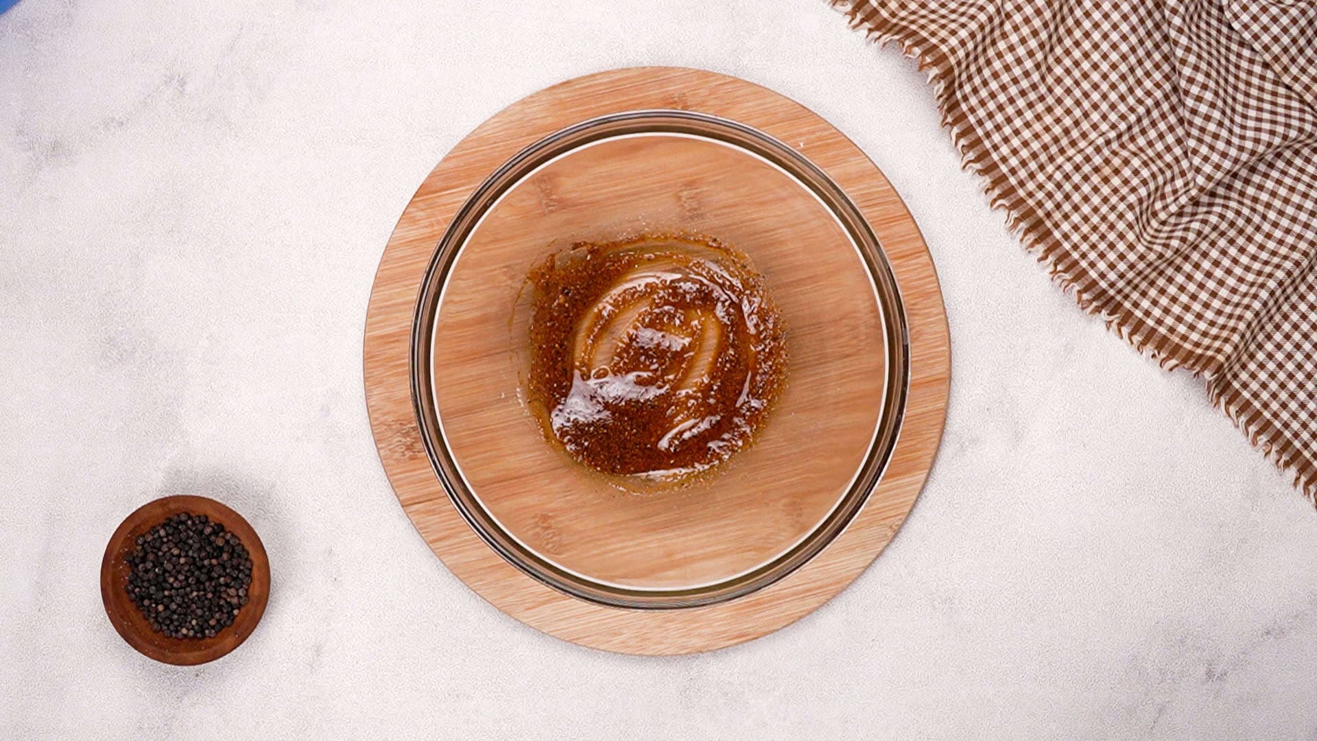 In a large bowl, combine the olive oil, paprika, garlic powder, salt, and black pepper. 