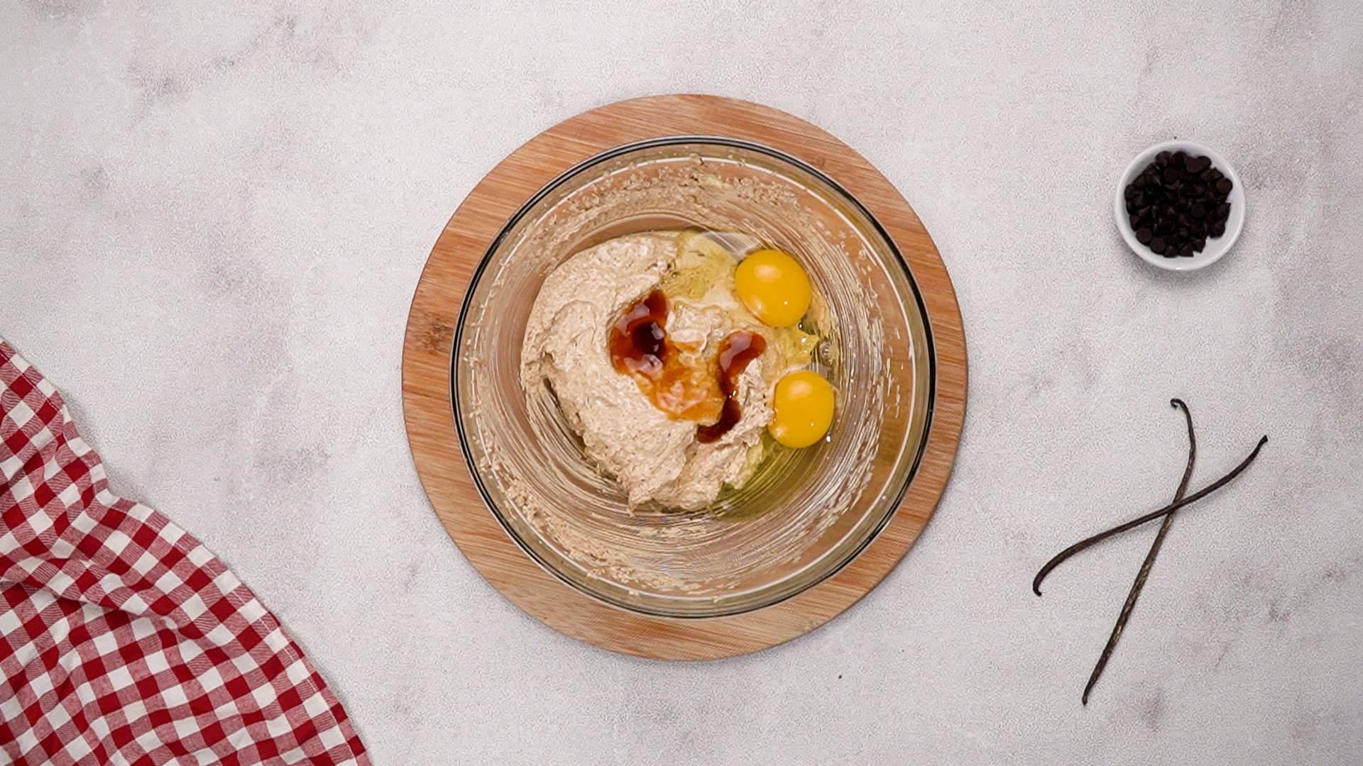 Once that's done, with the mixer on low speed, add the eggs and vanilla extract. Turn the mixer up to medium-high and beat until the mixture is fully combined.