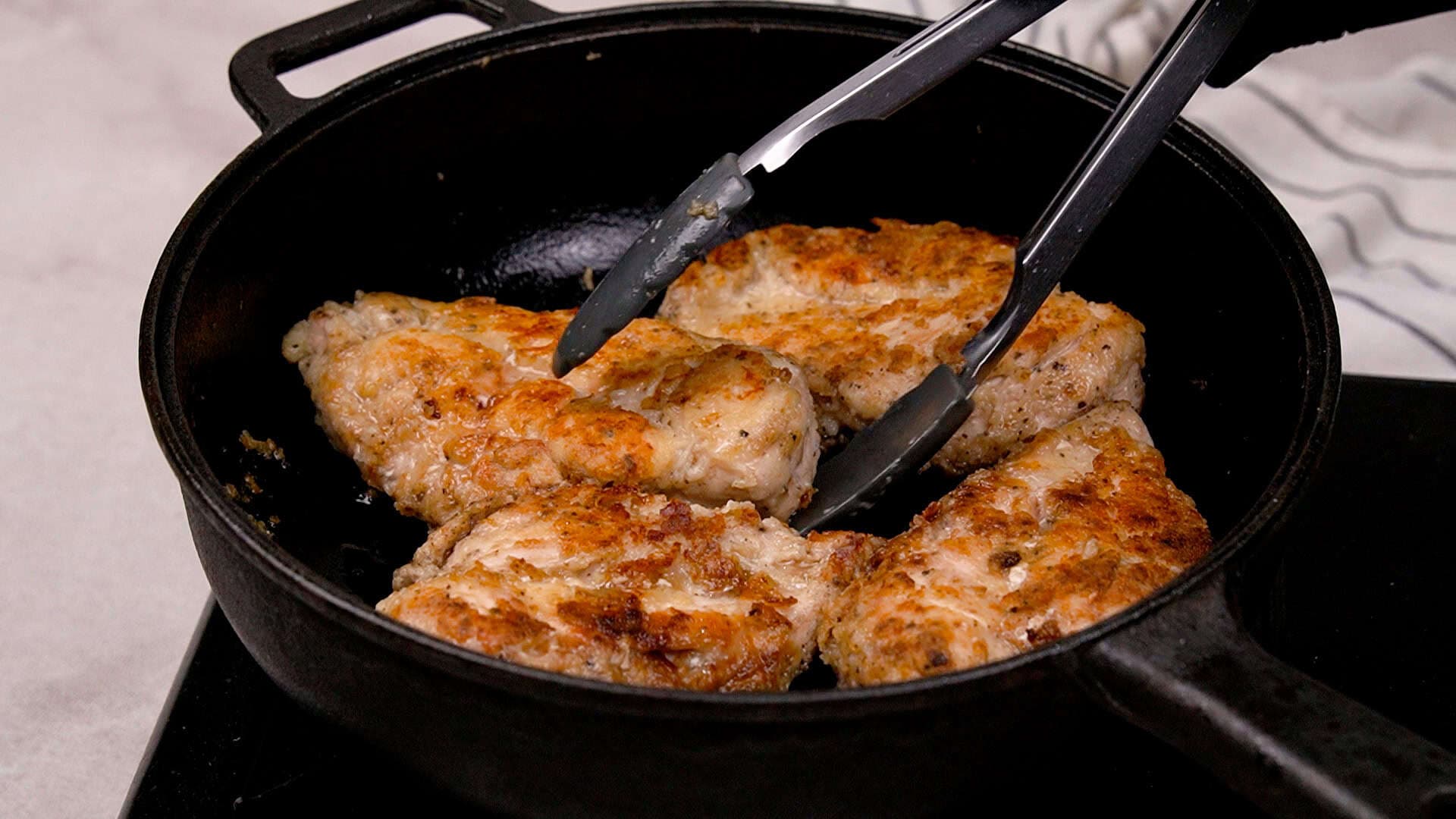 Once the oil is hot, add the chicken and sear it for 4–5 minutes per side, until it's beautifully golden-brown. Remove the chicken from the pan and set it aside to rest.