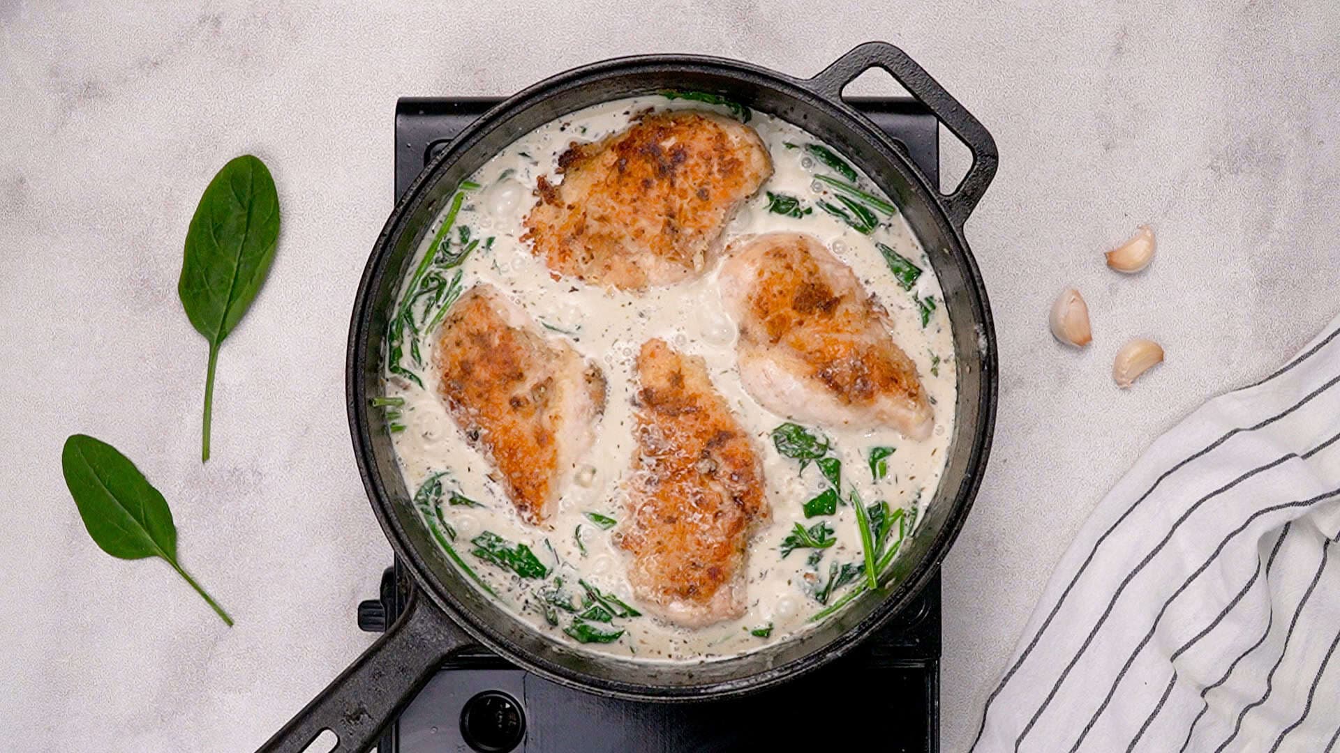 Return the chicken to the skillet and cook for another 4–5 minutes, until the chicken is cooked through and the chicken Florentine sauce has thickened up nicely.