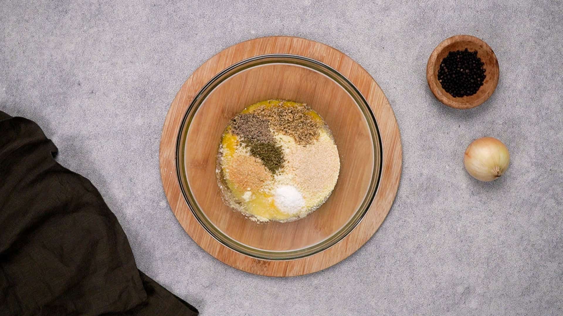 While it’s heating up, grab a mixing bowl and stir together all the ingredients except the ground beef.