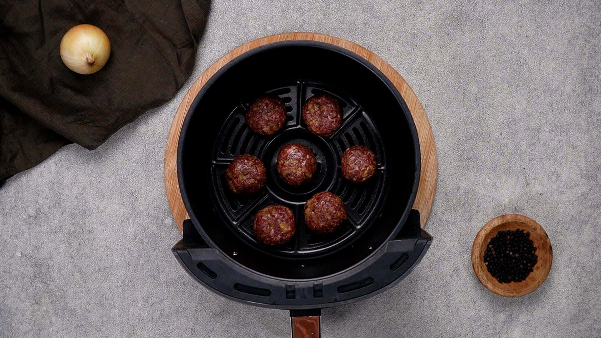 Place the meatballs in a single layer in the air fryer basket. Be sure not to overcrowd them, as that can prevent them from crisping up properly.