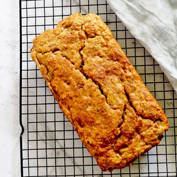 banana bread sitting on top of a cooling rack