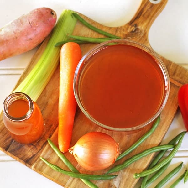 vegetable stock ingredients laid on top of a cutting board