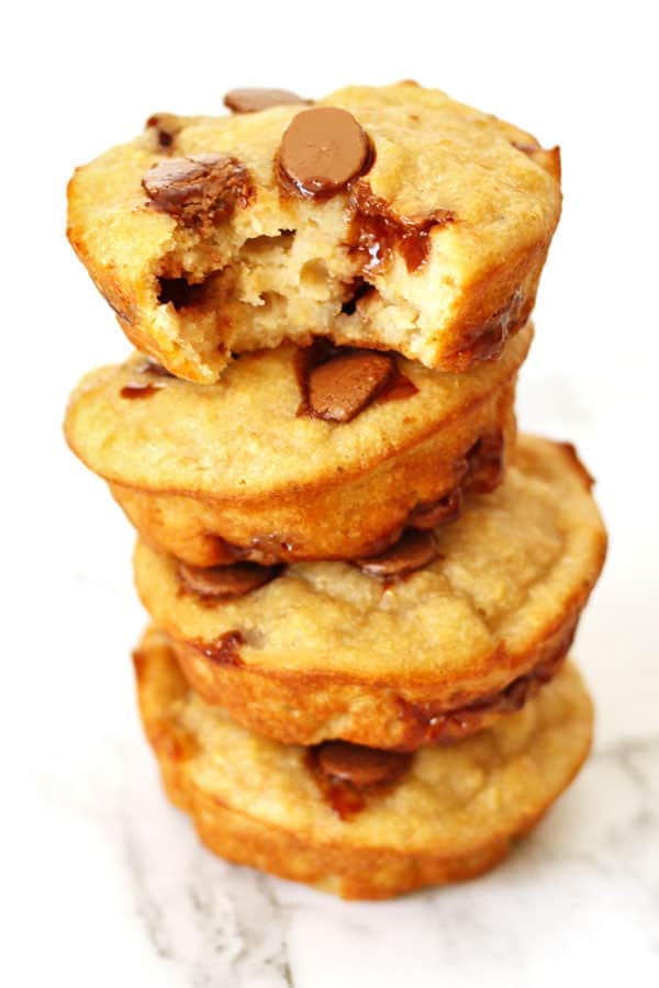 healthy banana chocolate chip muffins stacked on top of each other