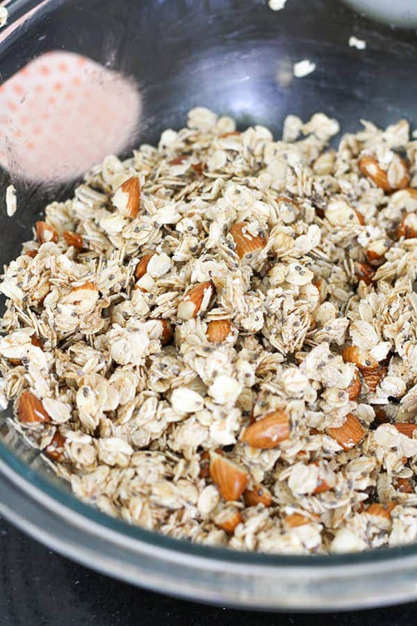 granola ingredients in a glass bowl.