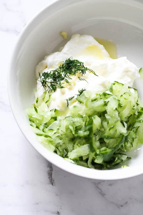 Greek Tzatziki ingredients in a white bowl