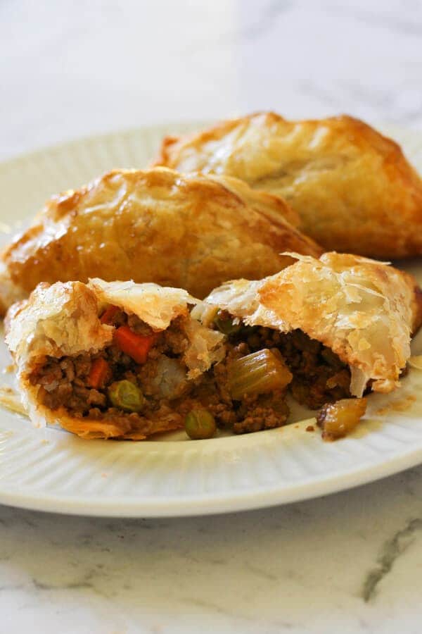 Beef Pasties on a white plate.