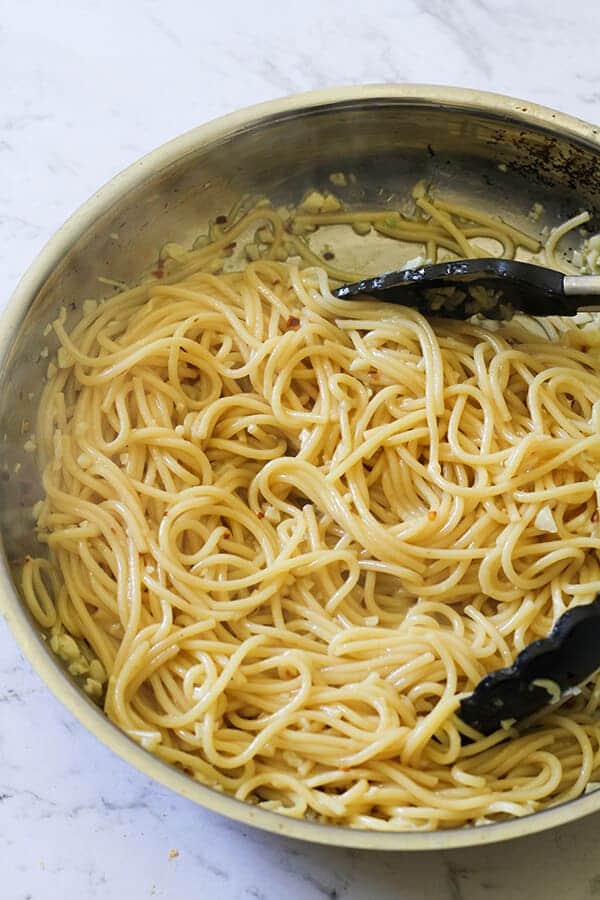 spaghetti in a frying pan.