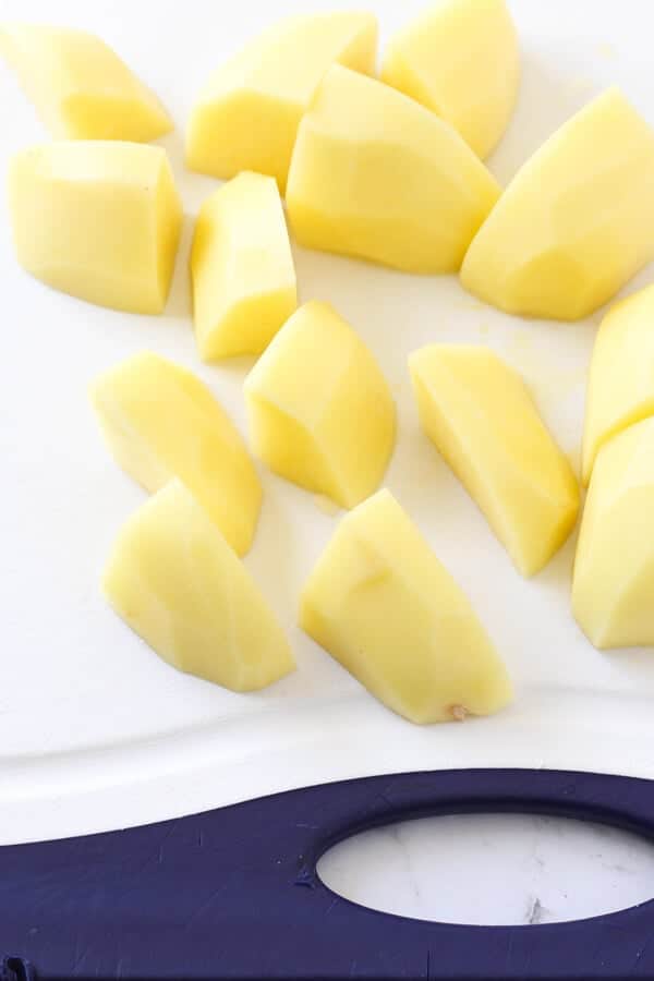 cut potatoes on a cutting board.