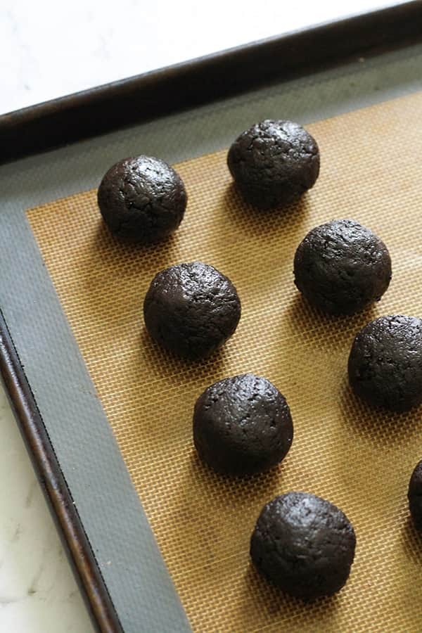 oreo balls on a baking tray.