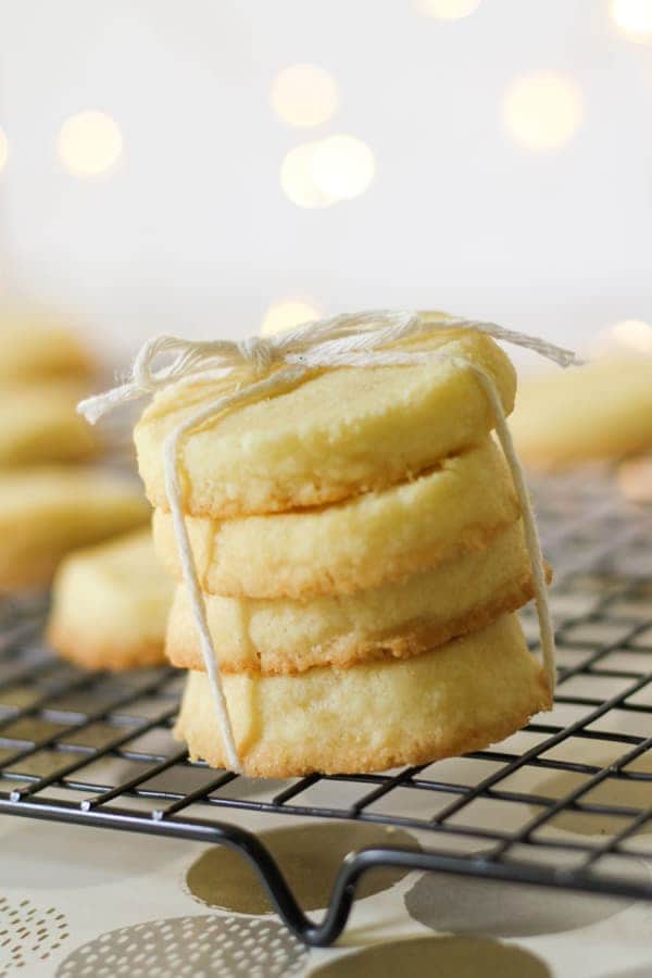 shortbread cookies stacked on top of a wire rack.