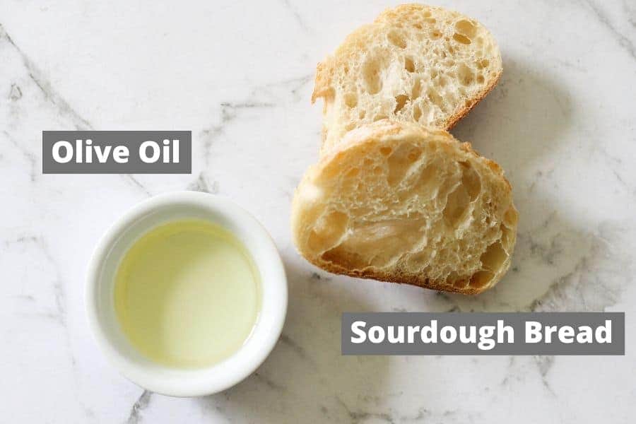 crouton ingredients on a white marble board.