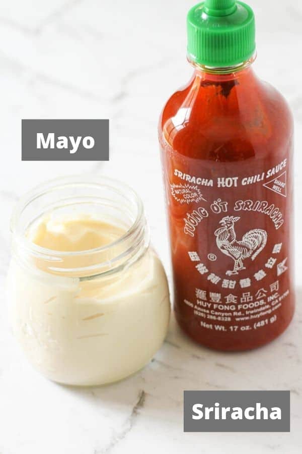spicy mayo ingredients on a white marble background.