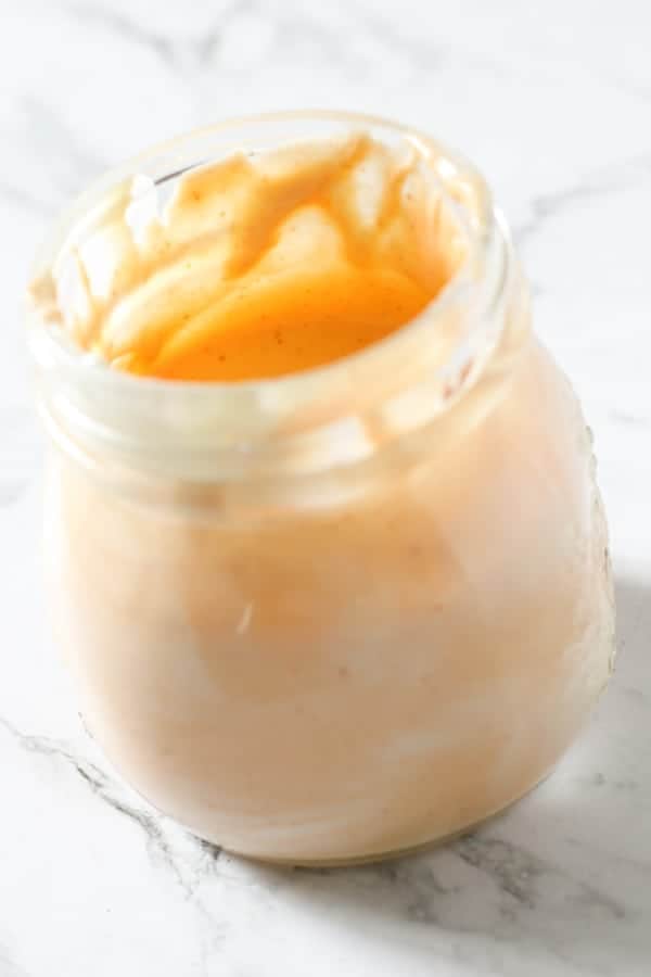 spicy mayonnaise in a glass jar.