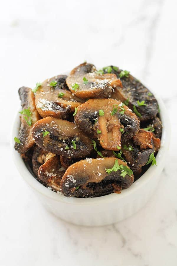air fryer mushrooms in a white serving bowl.