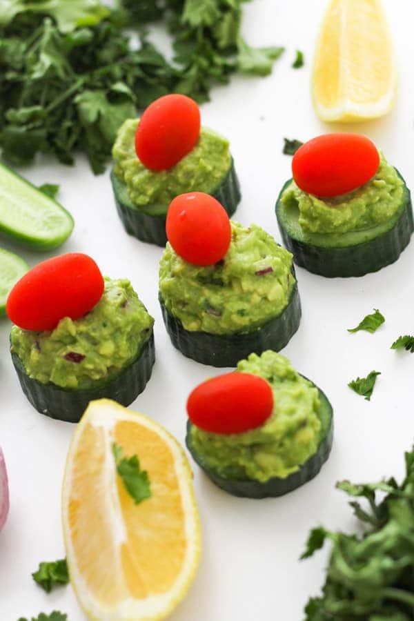 cucumber bites on a white table.