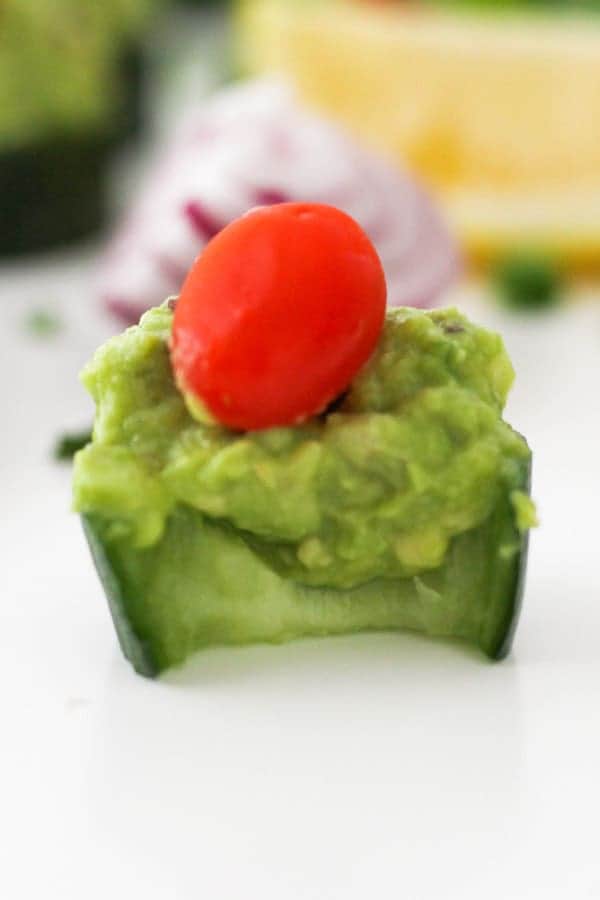 cucumber canape with a bite removed.