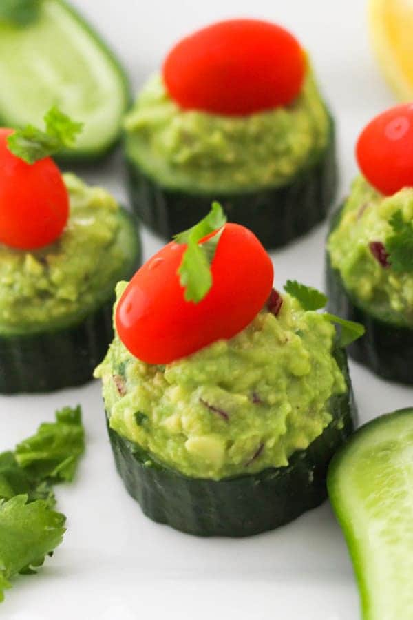 cucumber bites on a white table.
