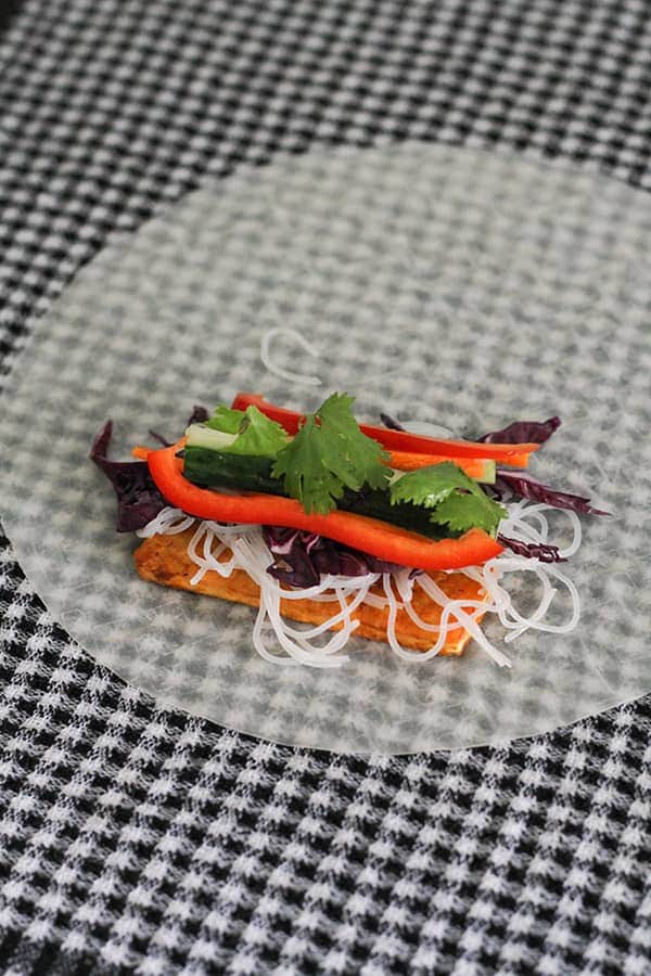 a rice paper wrapper with fillings in the middle.