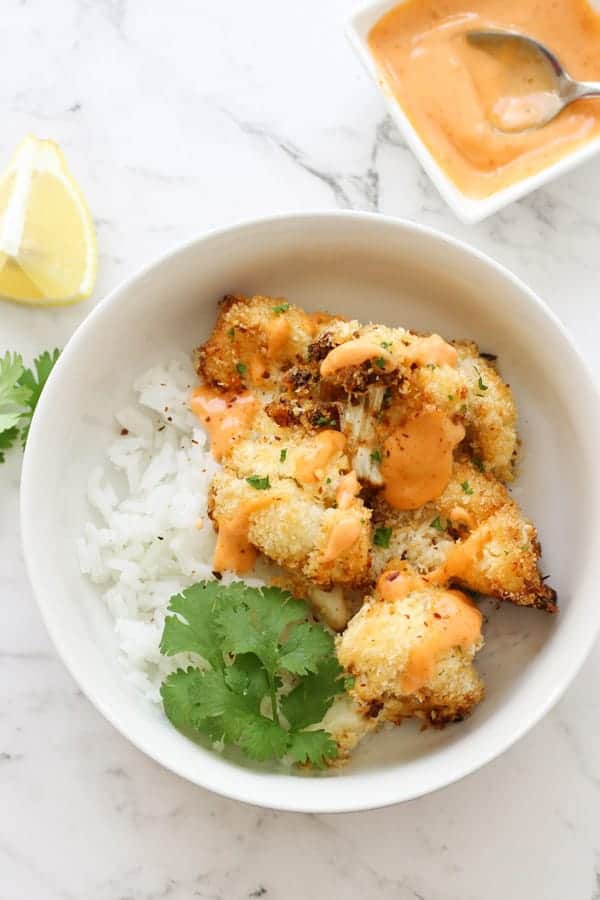 bang bang cauliflower on top of a bed of rice.